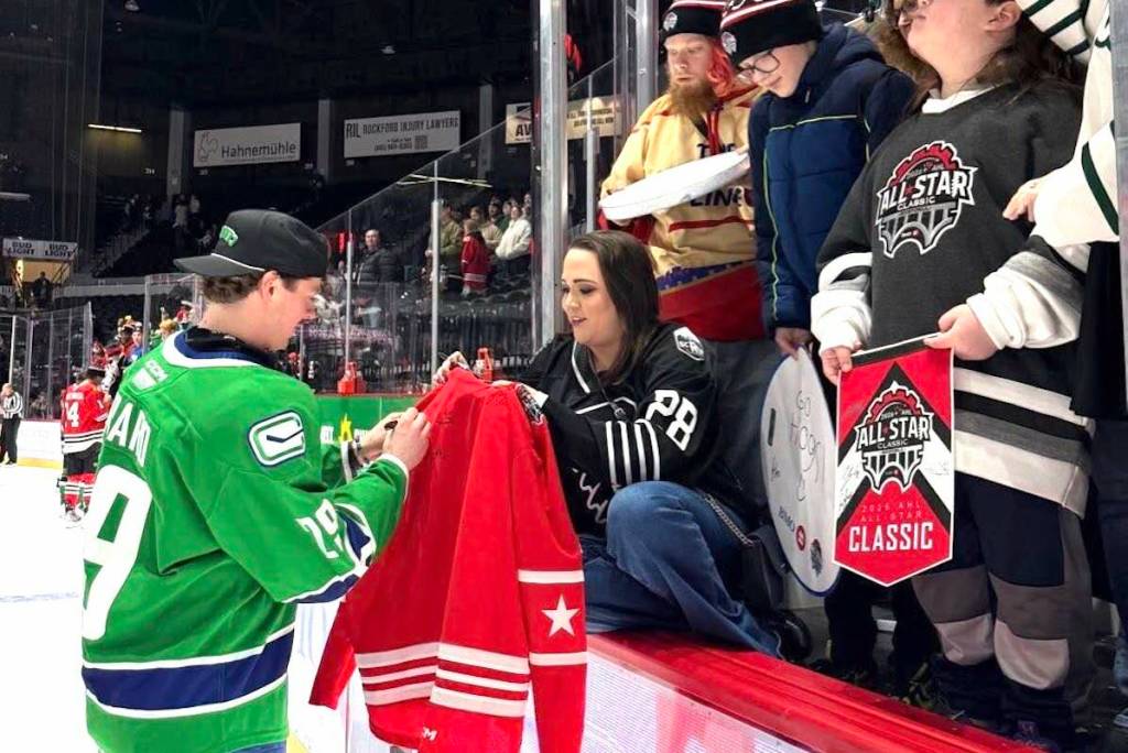 Duncan product Ben Berard signs autographs during the All-Star Skills Competition in Rockford, Illinois on Feb. 10. (Abbotsford Canucks/Facebook)