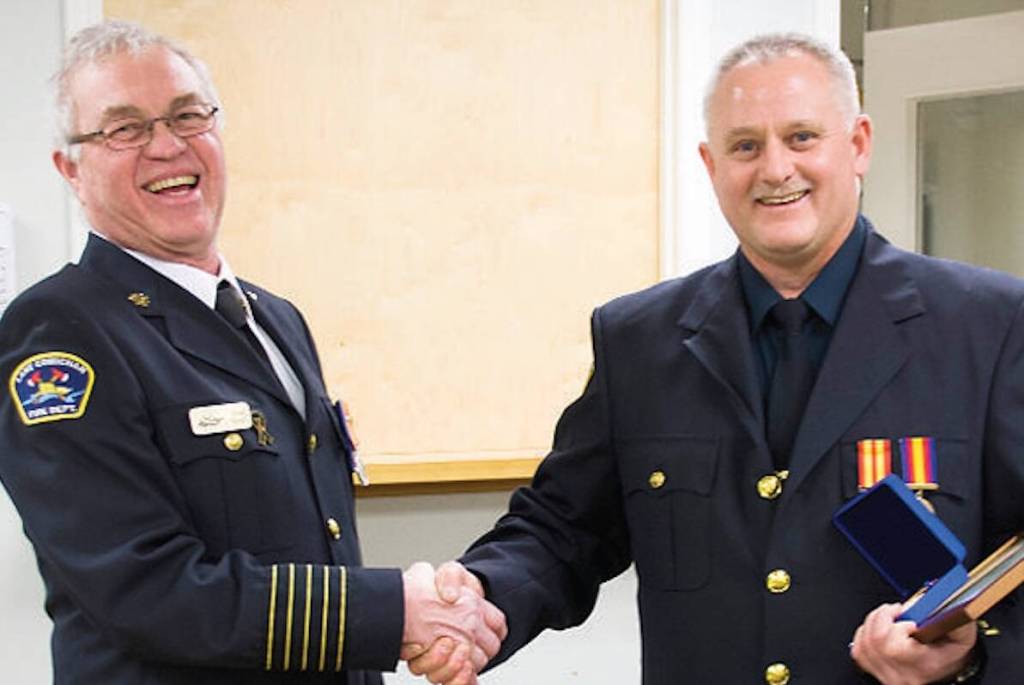 &rdquo;Lake Cowichan Volunteer Fire Department chief Doug Knott, left, presents firefighter David Janzen with a recognition for his 30 years of dedicated service.&rdquo; (Lake Cowichan Gazette/March 9, 2016)