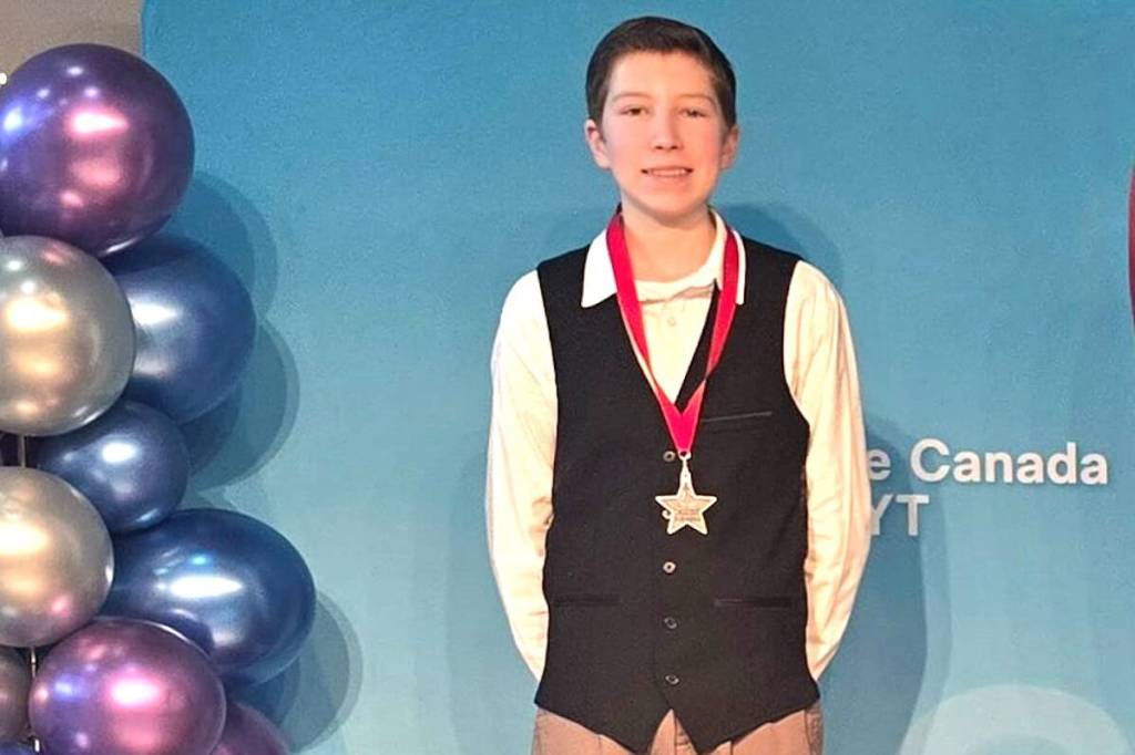 Fuller Lake Skating Club's Alex Jensen stands on the podium with a silver finish. (Kailee Bowman photo)